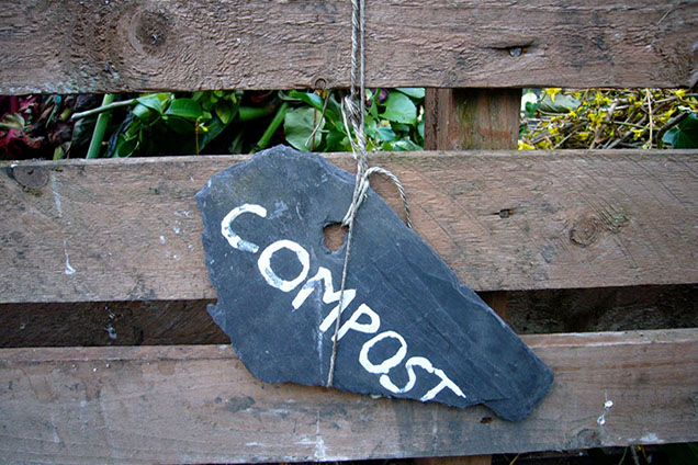 compost sign on wood fence