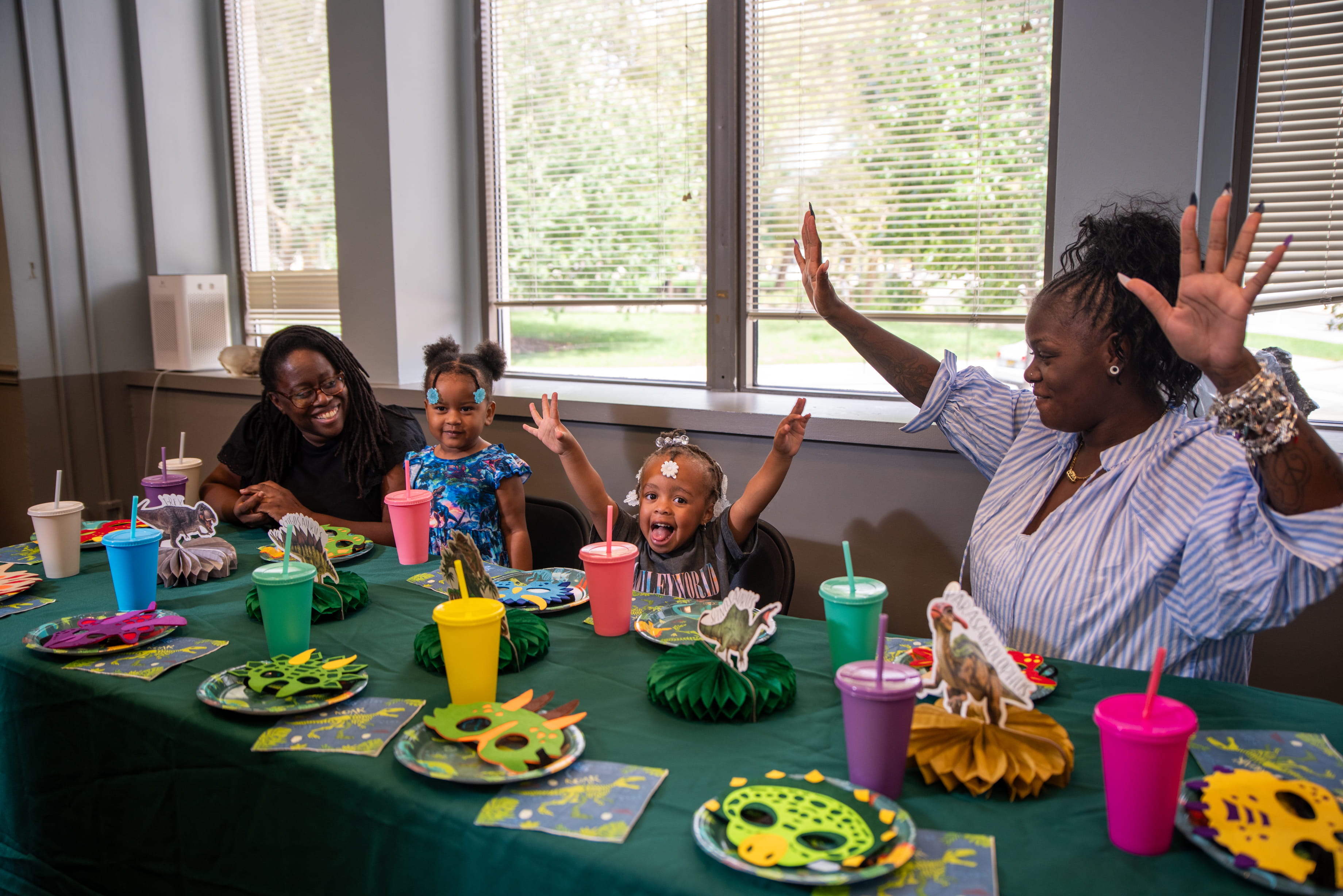 A group of people celebrating at a birthday party.