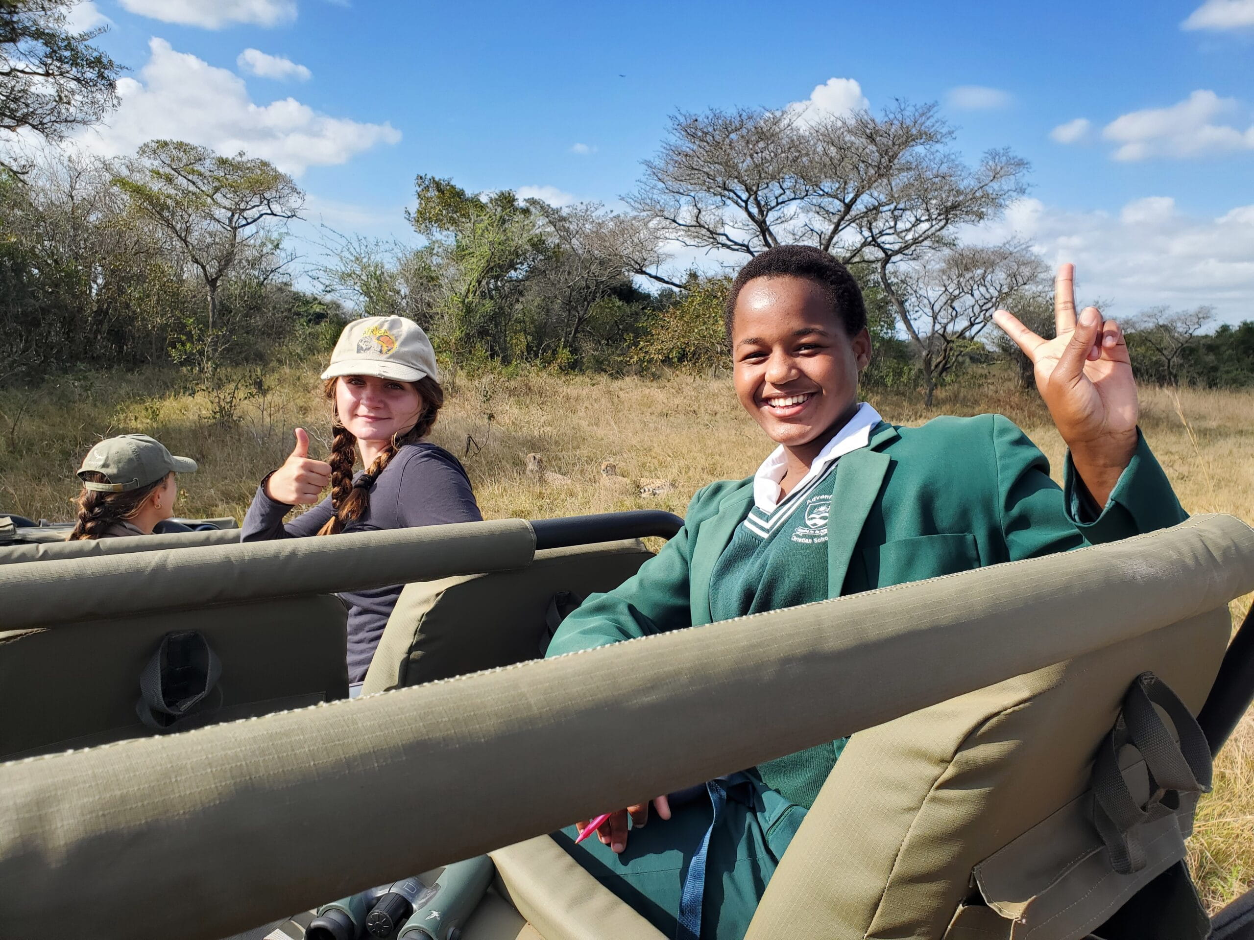 Two WINS students posing while in a car