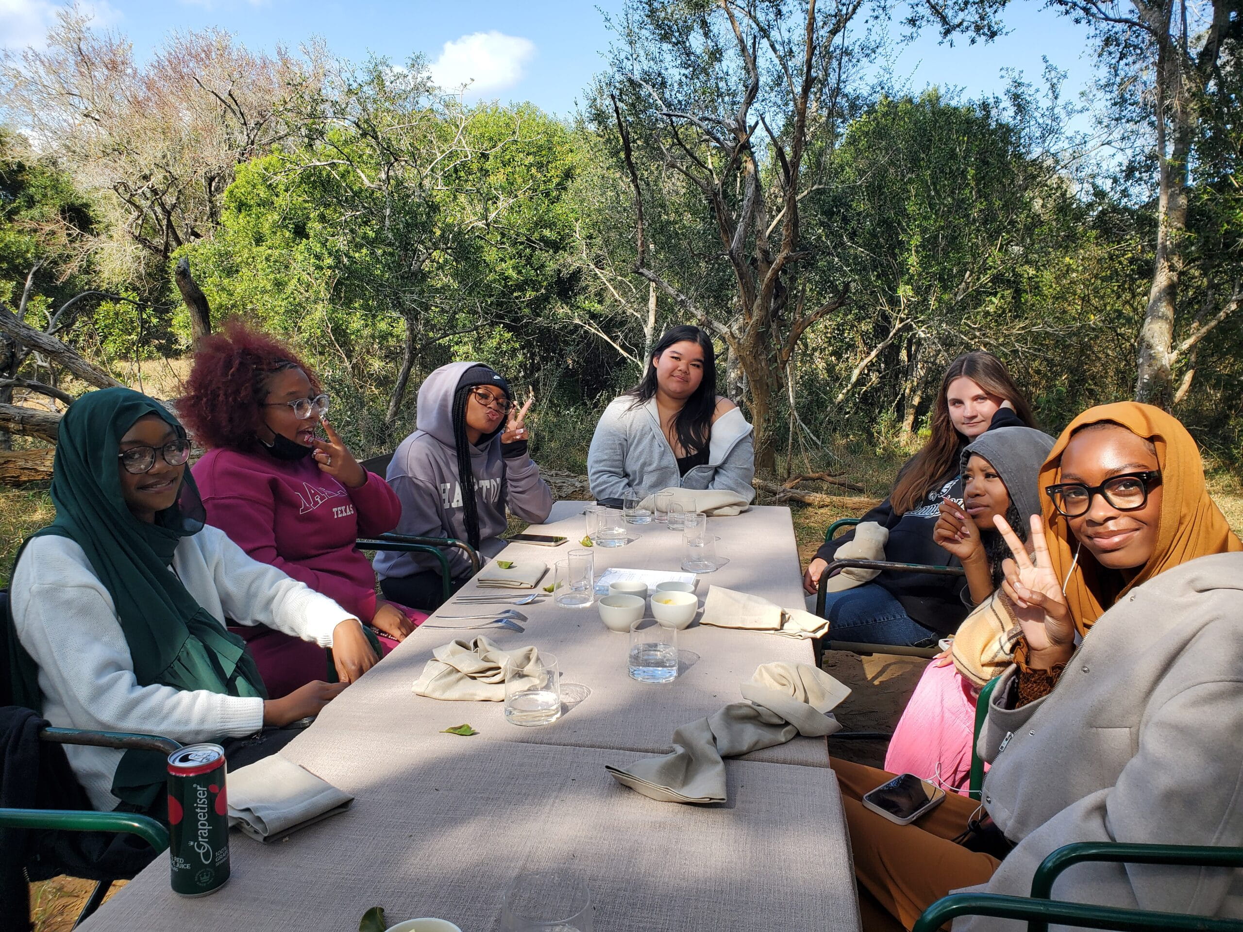 A group of WINS students sitting at a table,
