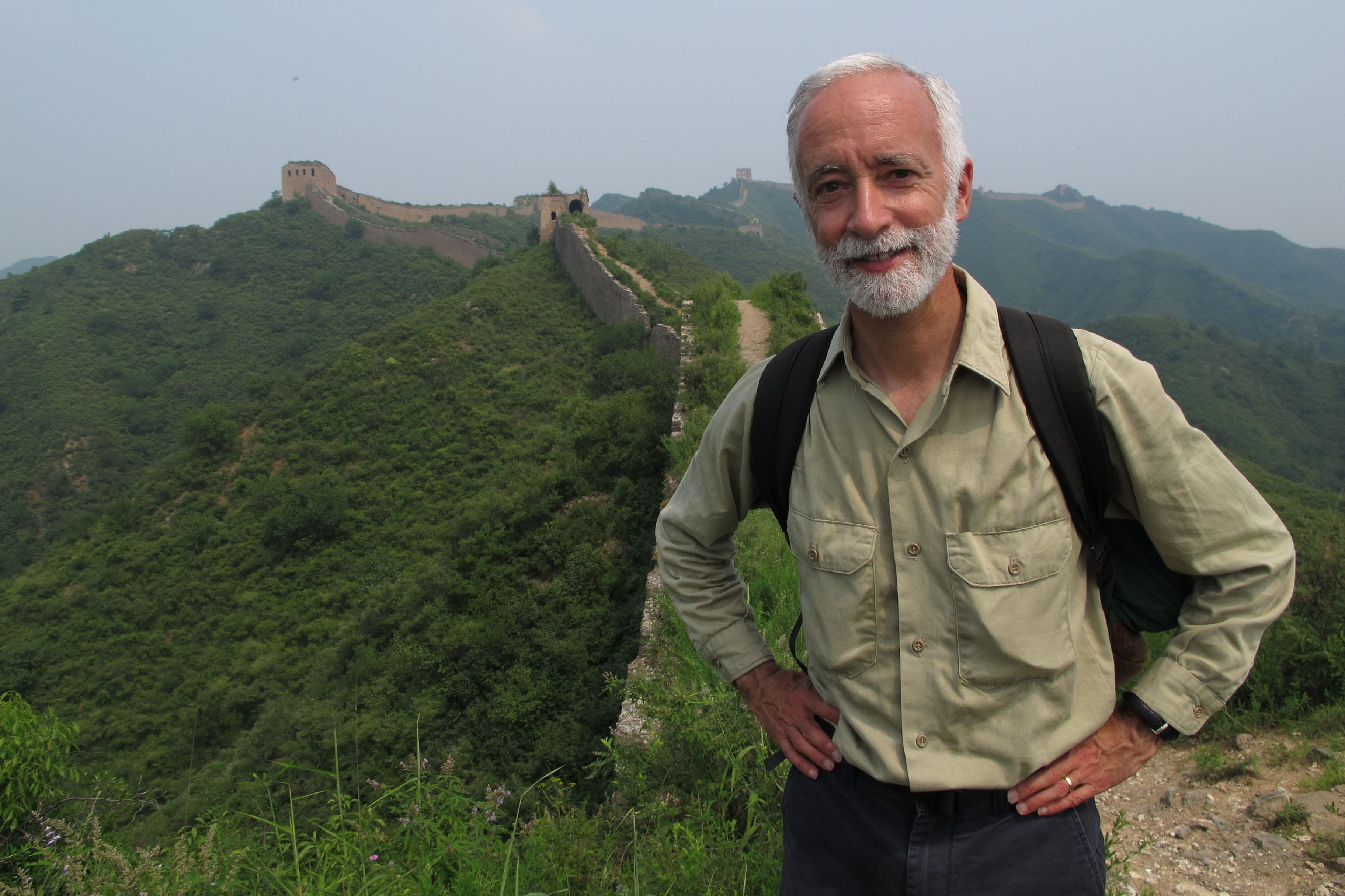 Bob Peck standing on top of the Great Wall of China.