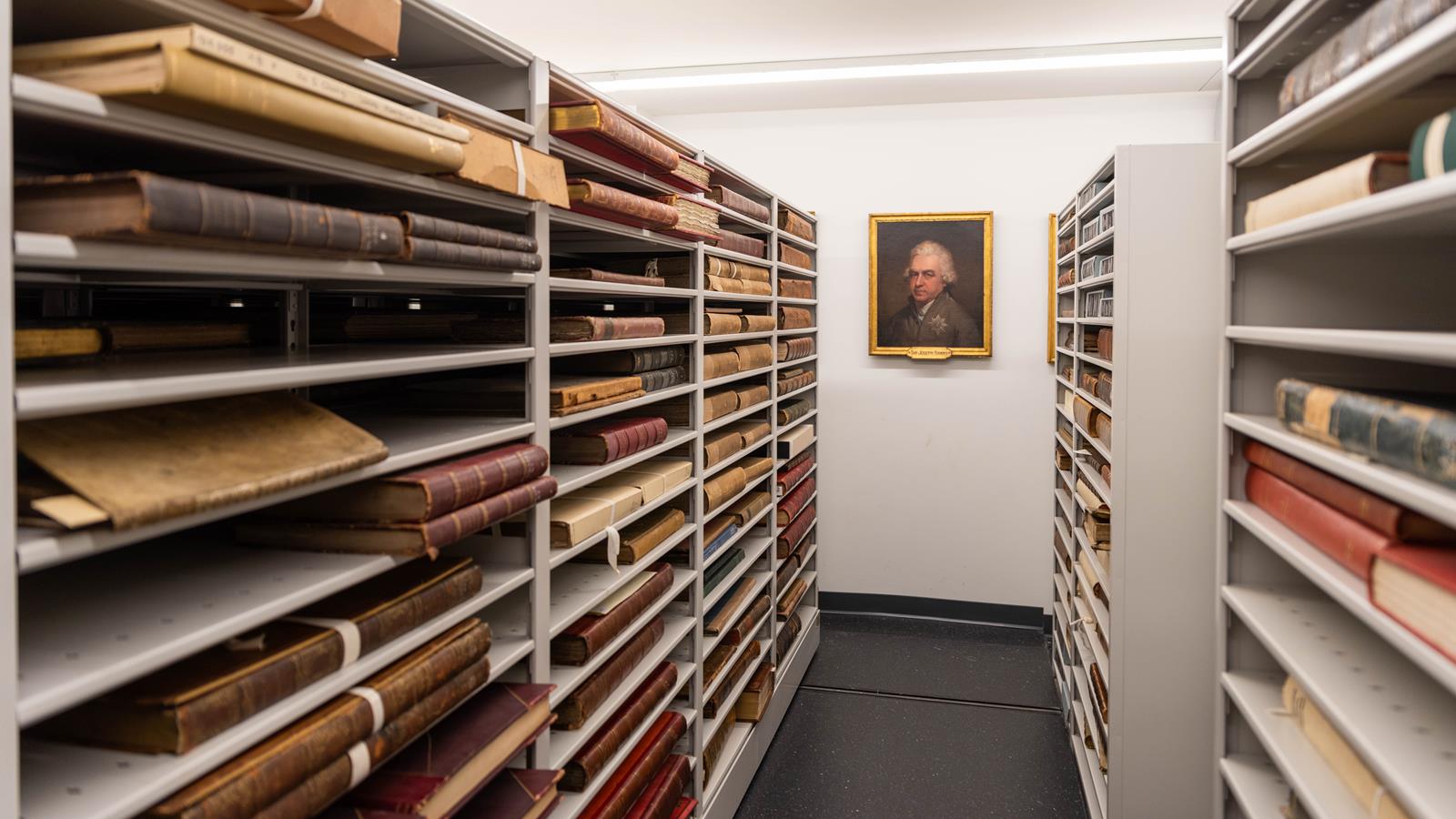 The library rare book room with a painting.