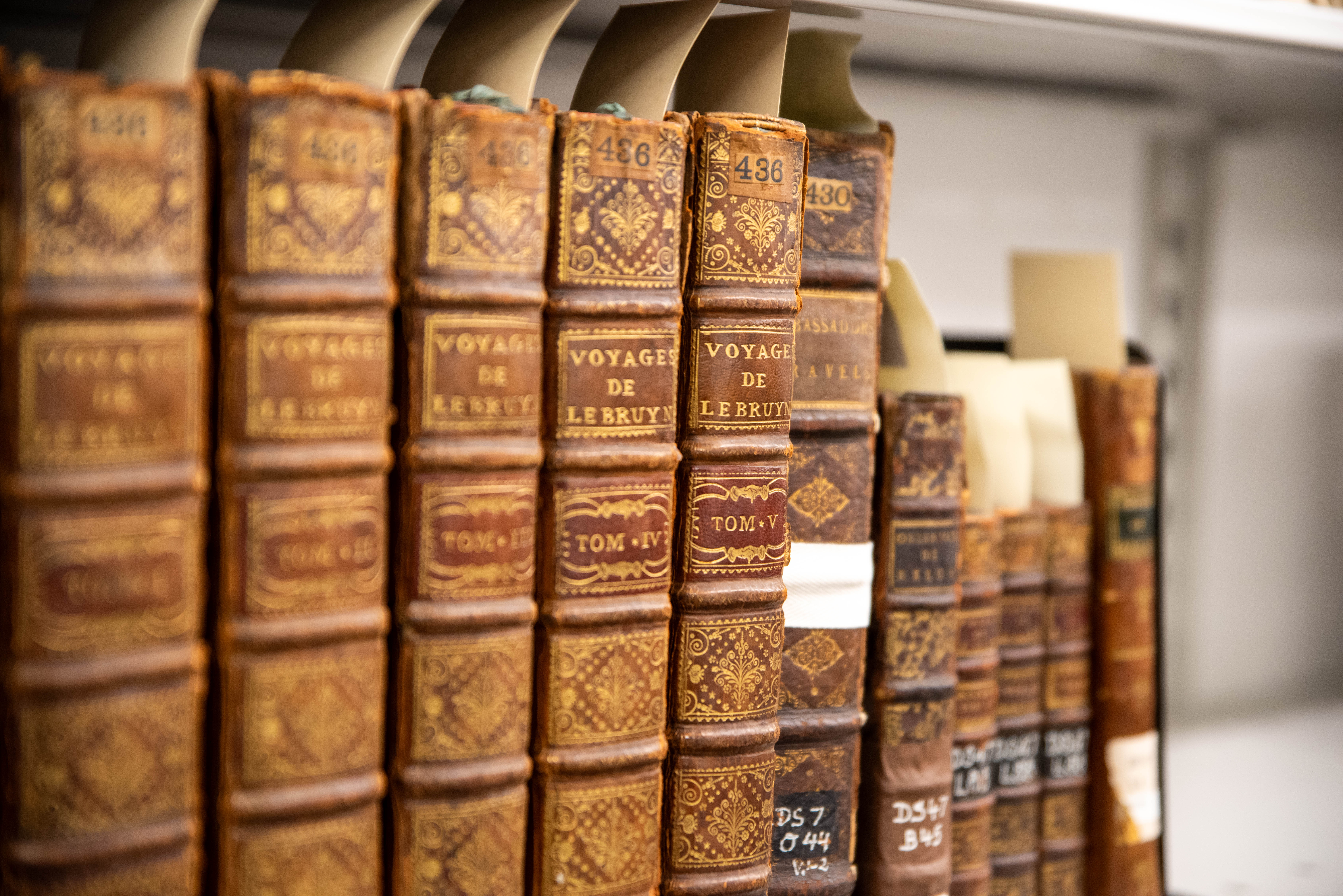 A close up of rare books in the library.