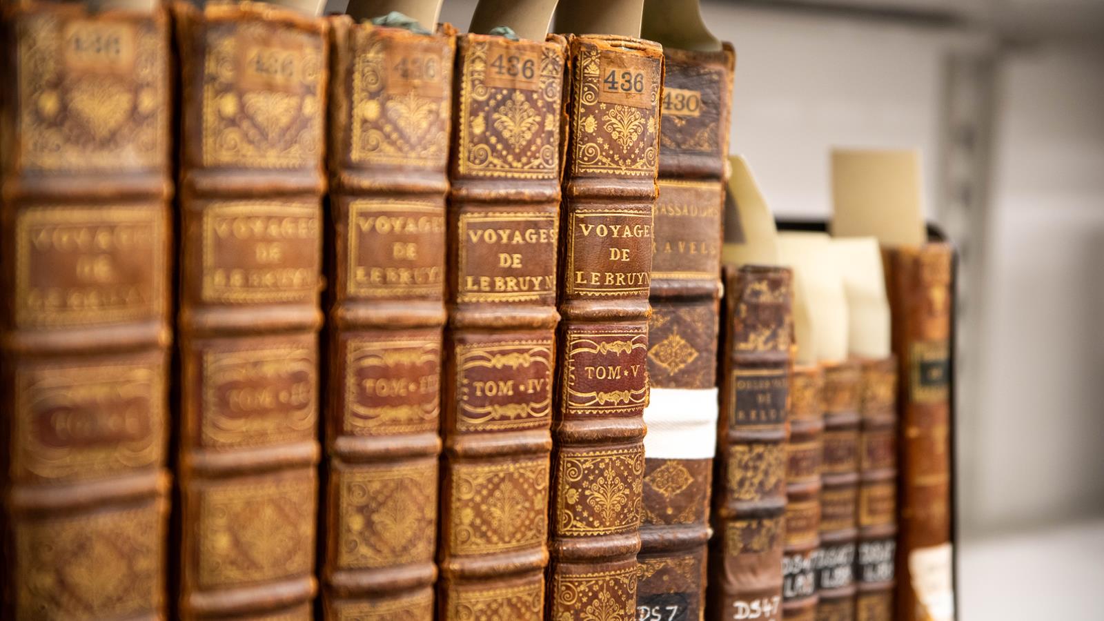 A close up of rare books in the library.