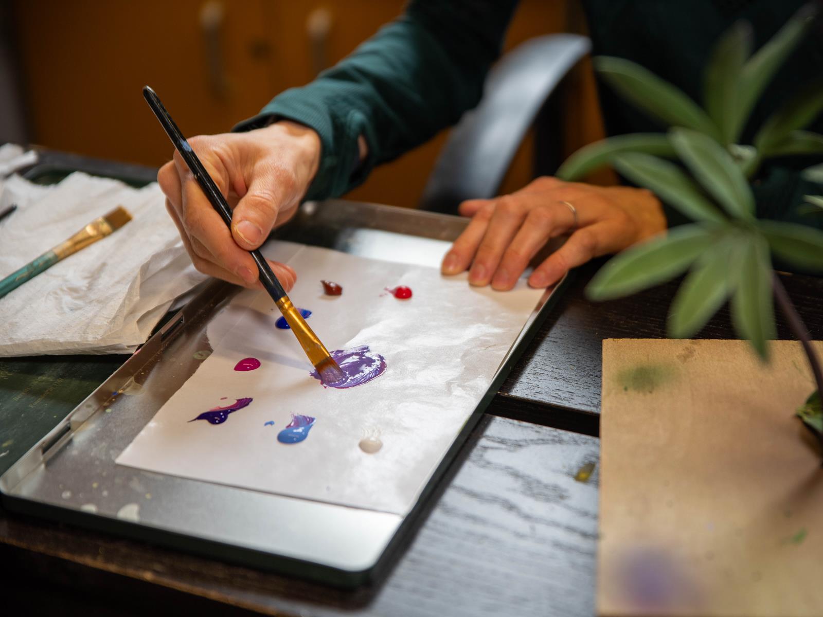A close-up of an artist mixing paint.