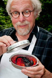"The Bug Chef" with a cooked scorpion. Photo by  Jeff Cole.