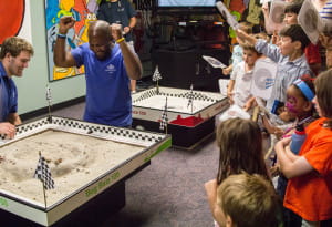 Playing Roach Race 500. Photo by Meredith Dolan/ANS.