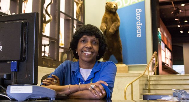 woman sitting in front of bear statue