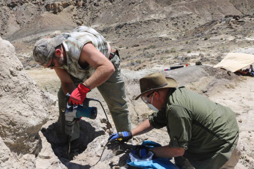 Using a jackhammer to clear away hard rock.