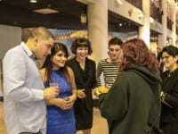 Educator shows live turtle to four young adults