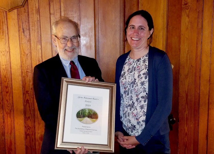 2 people w award