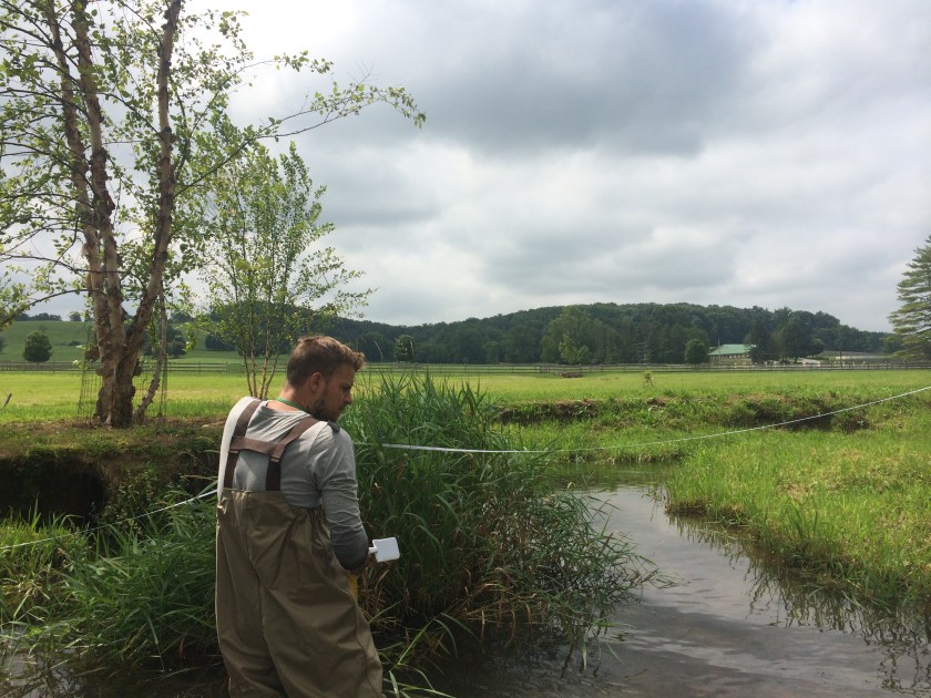 man by stream
