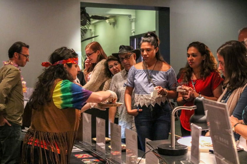 Woman serves chocolate to group of young women