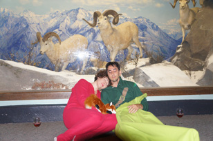 two adults, wine and diorama