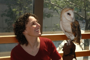 Academy educator holds an owl