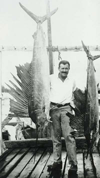 photo of Ernest Hemingway with two marlins