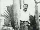 photo of Ernest Hemingway with two marlins