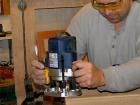 photo of a woodworker using a router