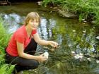 scientist collecting diatoms in a small stream