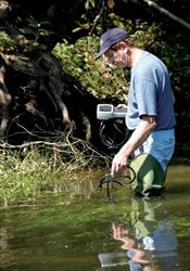 environmental chemist Paul Kiry measuring water quality