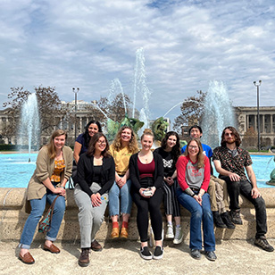 The Macroinvertebrate team pose in-front of a fountain.