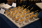 A plate with Hors D'oeuvres in glasses.